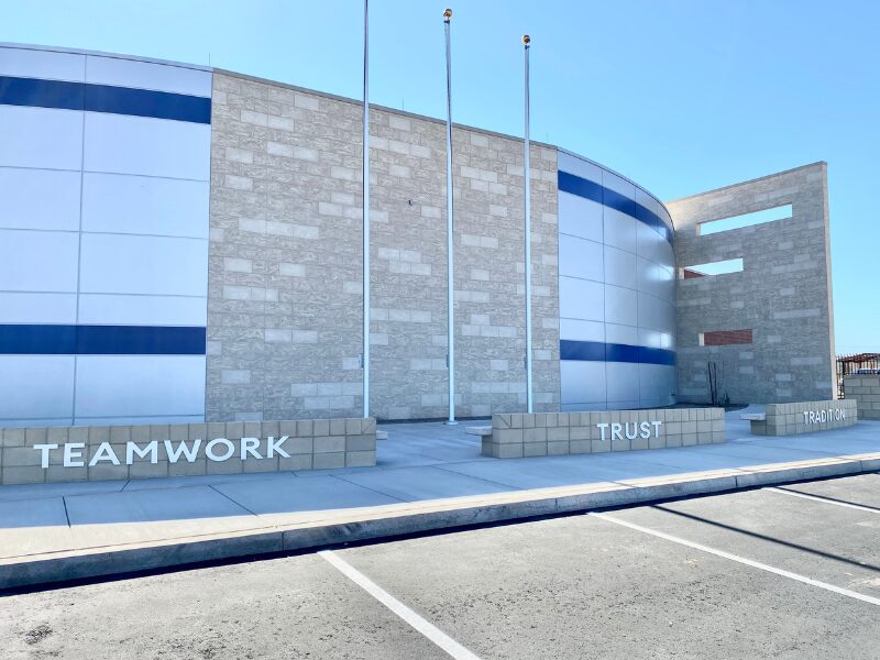 Image is of the Gilbert Public Safety Training Facility building made of brick and metal.