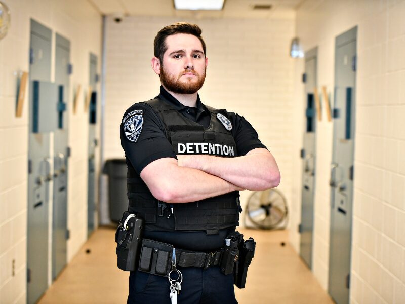 Detention officer crossing arms