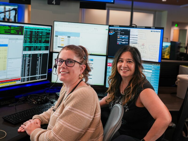 two dispatchers smiling
